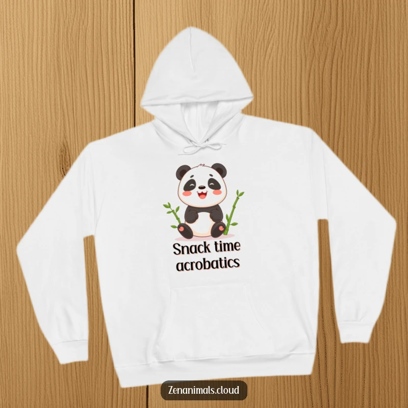 Funny hoodie depicting a happy panda skillfully juggling green bamboo shoots, perfect for cozy, humorous wear.