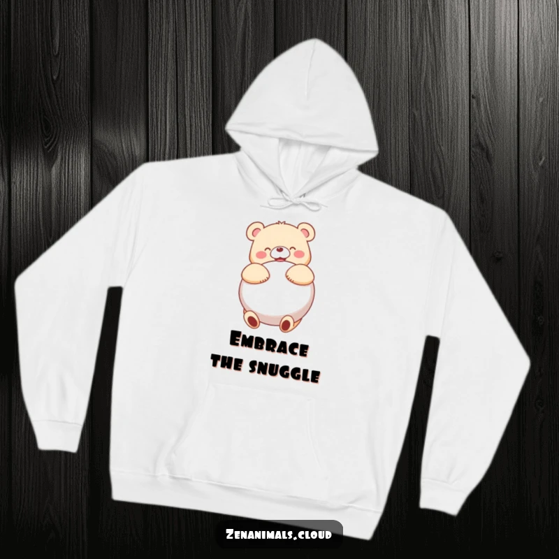 Funny bear character joyfully hugging a big, round cushion, perfect for this warm and humorous hoodie.