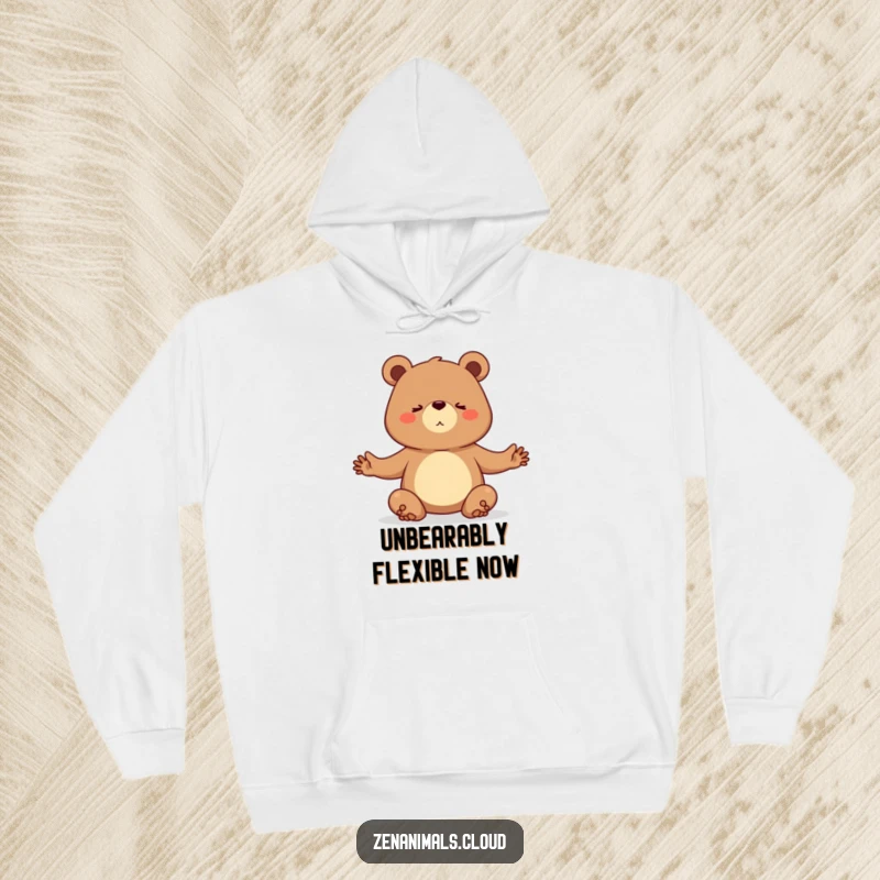 Funny hoodie with a determined bear practicing a challenging yoga pose, radiating strength and focus.