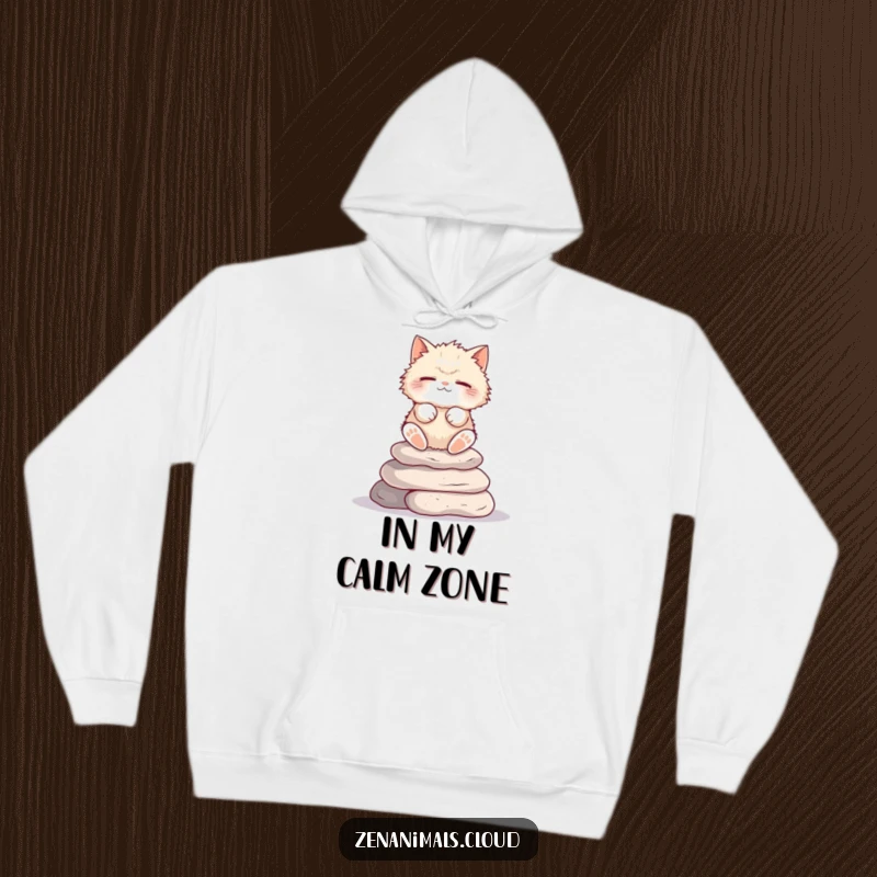 Funny Cat Hoodie: Fluffy cat meditating on stones, eyes closed, a cozy and humorous depiction.
