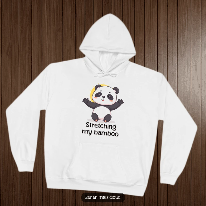 Funny playful panda doing a sun salutation on a hoodie, offering cozy zen and gentle humor.